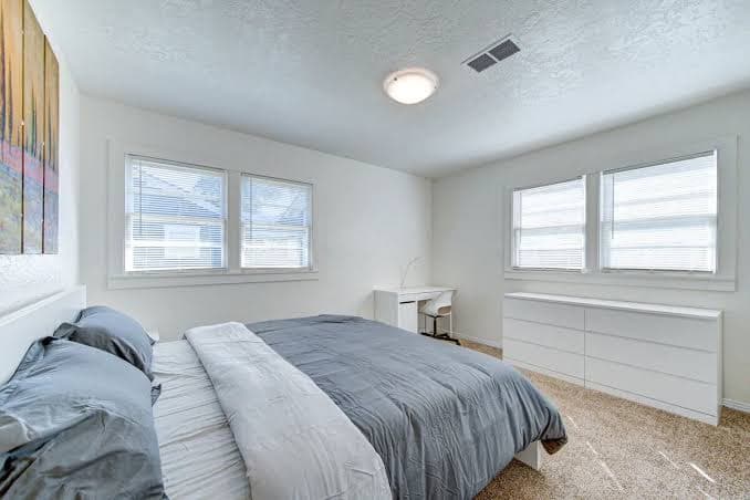 king bed with Pool table, decked patio and gym